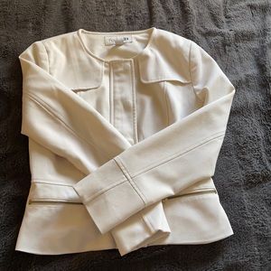 Timeless white jacket with gold zippers
